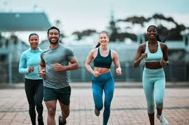 Sculpting Sleek Arms: The Essential Role of Cardio in Toning Without Bulking Up 3 image of people running to incorporate cardio Stratford-upon-Avon exercise into their life to help tone arms and body.
